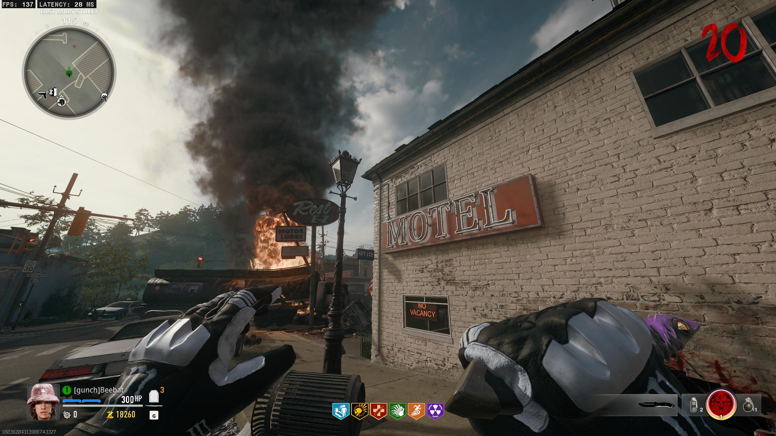 Motor Lodge · motel sign: Stand beside the motel and aim up at the figure on the ledge of the red MOTEL sign.